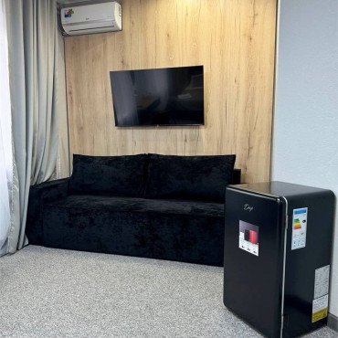 Номер "Четырехместный стандарт улучшенный с двуспальной кроватью и двухместным диваном"