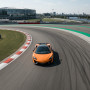 Заезд на спорткаре McLaren 570S на гоночном треке в Москве